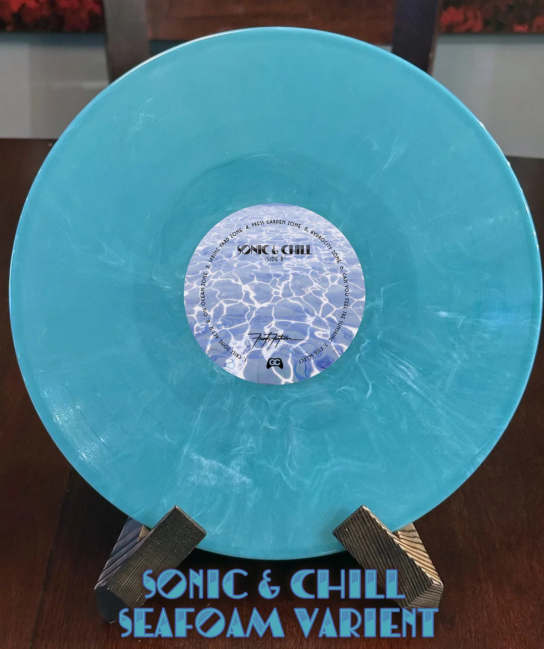 Blue vinyl record with a label on a stand, featuring 'Sonic & Chill' branding.