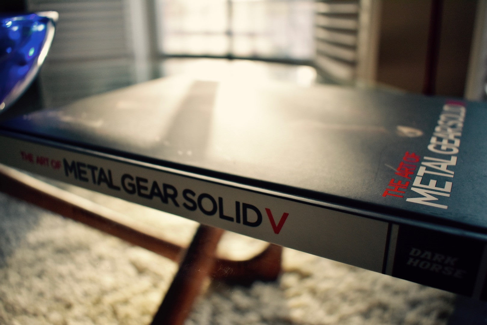 Metal gear solid 5 book on coffee table